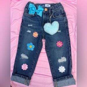 Girls slouchy jeans w/ patches and fuzzy heart